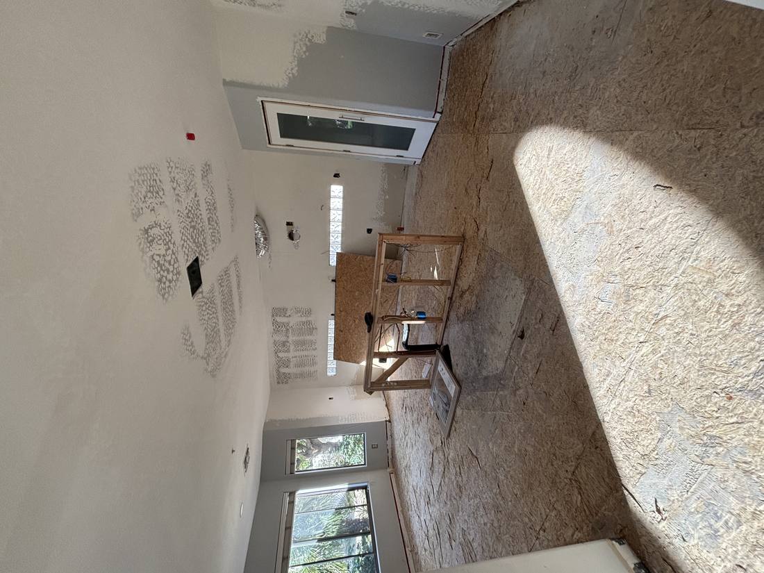 Kitchen demolition down to subfloor, framing exposed for new layout