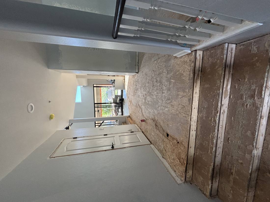 Hallway flooring removed down to subfloor